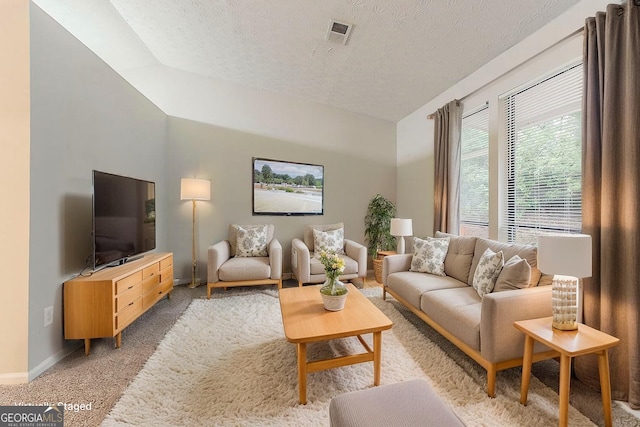 4905 Sandberg Ct, Stone Mountain, GA 30088 - living room with light colored carpet, a textured ceiling, and baseboards