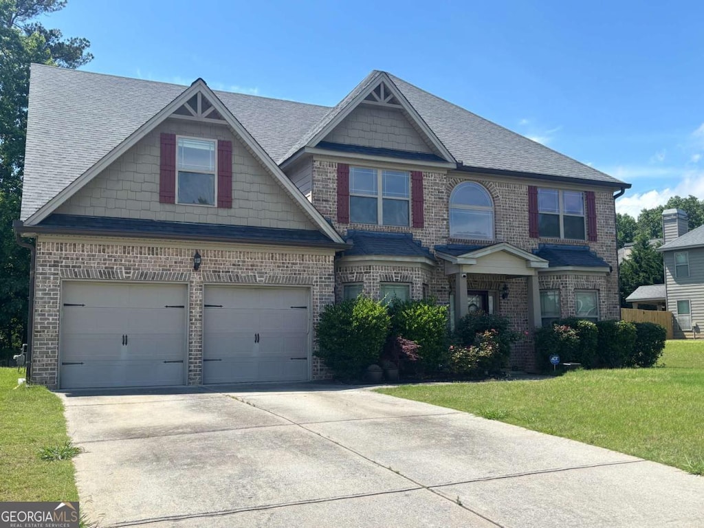 4482 Ridge Mill Ter NE, Douglasville, GA 30135 - craftsman house with brick siding, an attached garage, and concrete driveway