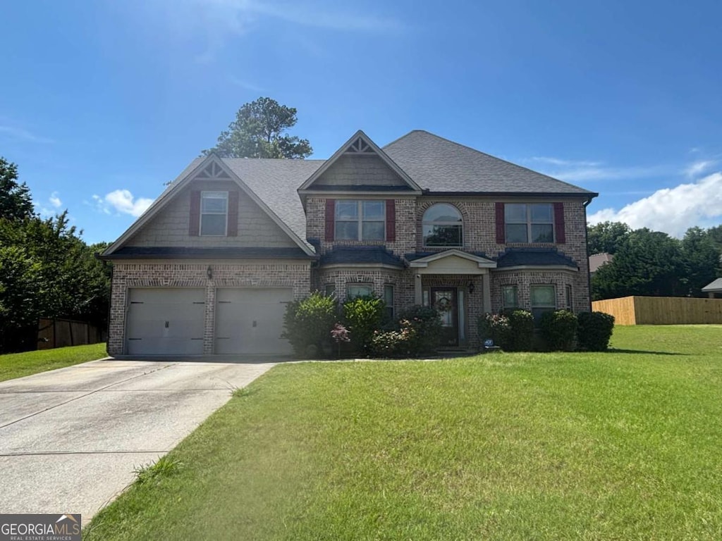 4482 Ridge Mill Ter NE, Douglasville, GA 30135 - view of front of home with a garage, brick siding, concrete driveway, and a shingled roof