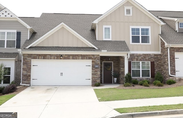 2845 Long Shadow Ct, Snellville, GA 30078 - craftsman house with board and batten siding, roof with shingles, driveway, and stone siding