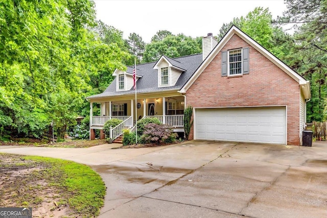 2200 E Lake Rd, Mcdonough, GA 30252 - cape cod home featuring a porch, a garage, driveway, and brick siding
