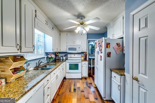 2200 E Lake Rd, Mcdonough, GA 30252 - kitchen featuring white appliances, ceiling fan, wood-type flooring, a textured ceiling, and white cabinetry