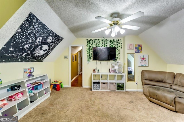 2200 E Lake Rd, Mcdonough, GA 30252 - recreation room with lofted ceiling, carpet floors, a textured ceiling, and ceiling fan