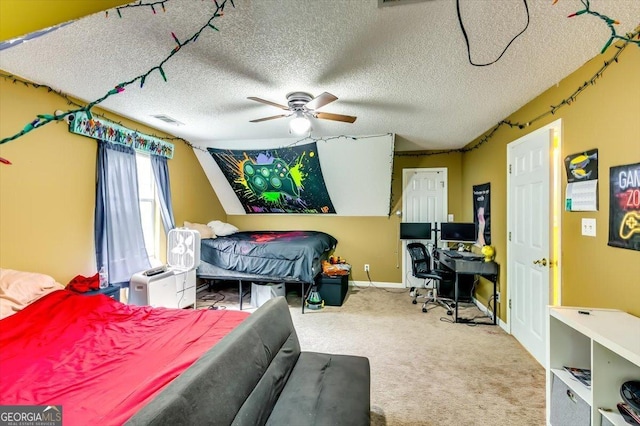 2200 E Lake Rd, Mcdonough, GA 30252 - bedroom with a textured ceiling, carpet flooring, ceiling fan, and vaulted ceiling