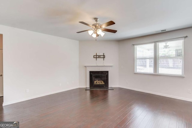 385 Broadmoor Dr, Braselton, GA 30517 - unfurnished living room with a ceiling fan, dark wood-type flooring, a premium fireplace, and baseboards
