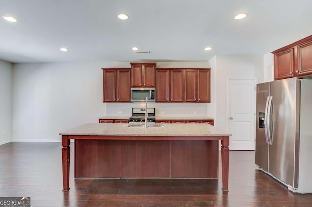 385 Broadmoor Dr, Braselton, GA 30517 - kitchen with stainless steel appliances, a sink, light stone countertops, dark wood-style flooring, and recessed lighting