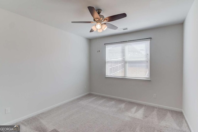 385 Broadmoor Dr, Braselton, GA 30517 - spare room featuring light colored carpet, a ceiling fan, and baseboards