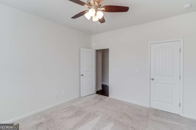 385 Broadmoor Dr, Braselton, GA 30517 - unfurnished bedroom featuring carpet floors, baseboards, and ceiling fan