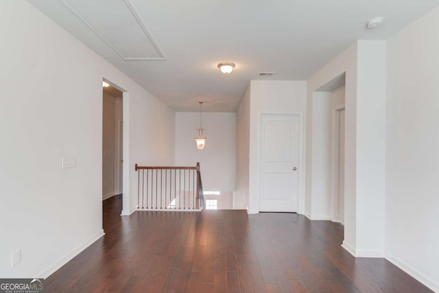 385 Broadmoor Dr, Braselton, GA 30517 - spare room with attic access, dark wood finished floors, and baseboards