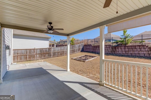 385 Broadmoor Dr, Braselton, GA 30517 - fenced backyard with a ceiling fan and a patio area