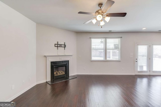 385 Broadmoor Dr, Braselton, GA 30517 - unfurnished living room with a ceiling fan, a premium fireplace, dark wood-style flooring, and baseboards