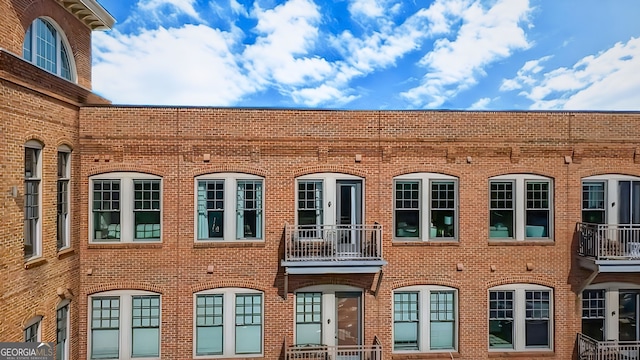 360 Chambers St Unit 405, Woodstock, GA 30188 - view of side of property with brick siding