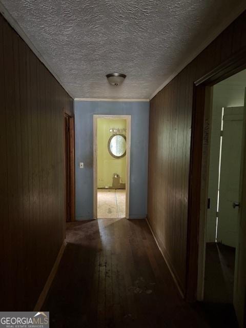 9610 Ga Highway 242, Harrison, GA 31035 - hallway featuring wood walls, wood finished floors, and ornamental molding