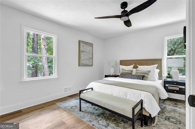 5666 Fawn Dr, Powder Springs, GA 30127 - bedroom featuring wood finished floors, baseboards, and ceiling fan