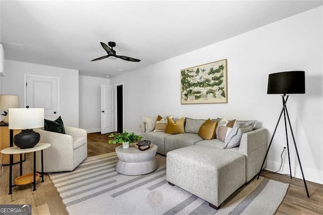 5666 Fawn Dr, Powder Springs, GA 30127 - living area featuring ceiling fan, baseboards, and light wood-type flooring