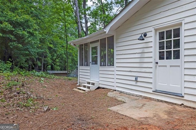 5666 Fawn Dr, Powder Springs, GA 30127 - view of side of property with entry steps and a sunroom