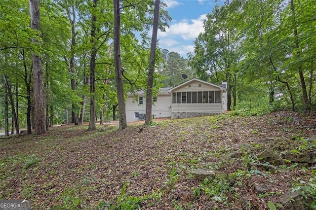 5666 Fawn Dr, Powder Springs, GA 30127 - view of yard featuring a sunroom