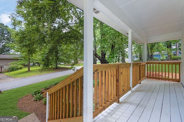5666 Fawn Dr, Powder Springs, GA 30127 - wooden porch with a yard