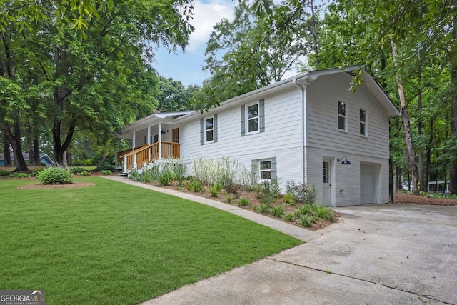5666 Fawn Dr, Powder Springs, GA 30127 - view of front of house with an attached garage, driveway, and a front lawn