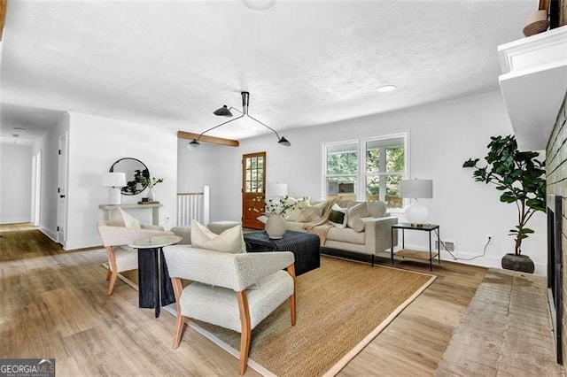 5666 Fawn Dr, Powder Springs, GA 30127 - living room featuring light wood-style floors and a textured ceiling