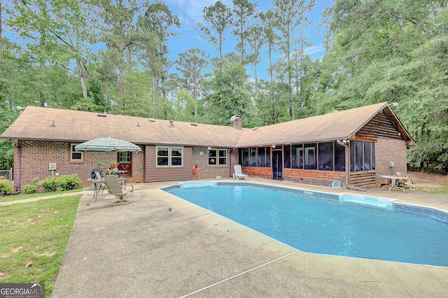 9706 Holly Hill Way, Jonesboro, GA 30238 - outdoor pool with a sunroom and a patio area