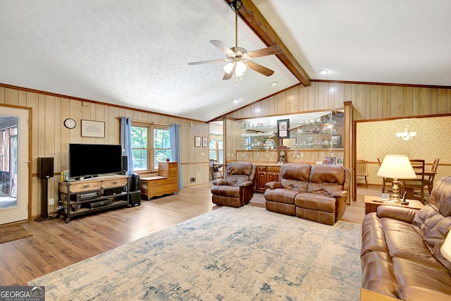 9706 Holly Hill Way, Jonesboro, GA 30238 - living room featuring wood finished floors, ceiling fan, wooden walls, and crown molding