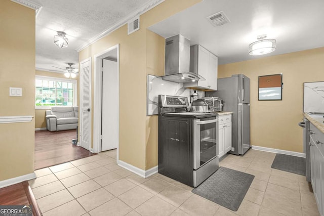 2952 N Dekalb Dr Unit C, Atlanta, GA 30340 - kitchen with stainless steel appliances, wall chimney exhaust hood, ceiling fan, light tile patterned floors, and ornamental molding
