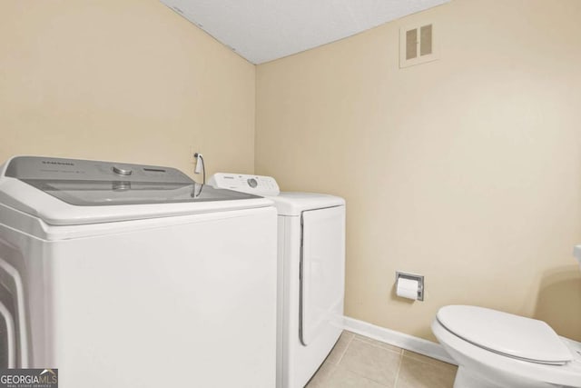 2952 N Dekalb Dr Unit C, Atlanta, GA 30340 - laundry room with washer and dryer and light tile patterned flooring