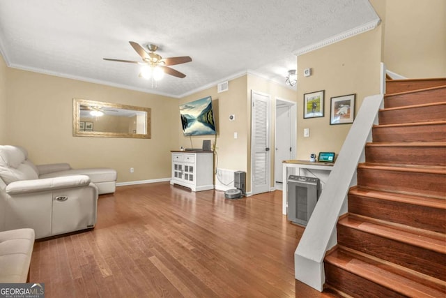 2952 N Dekalb Dr Unit C, Atlanta, GA 30340 - living room featuring stairway, wood finished floors, ornamental molding, a ceiling fan, and a textured ceiling