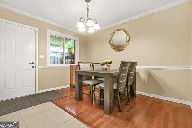 2952 N Dekalb Dr Unit C, Atlanta, GA 30340 - dining room featuring a chandelier, crown molding, and wood finished floors