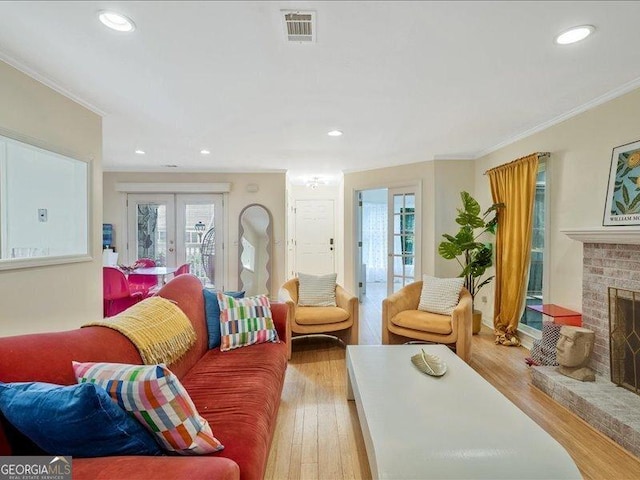 212 Abingdon Way, Sandy Springs, GA 30328 - living room featuring french doors, plenty of natural light, wood finished floors, ornamental molding, and a fireplace