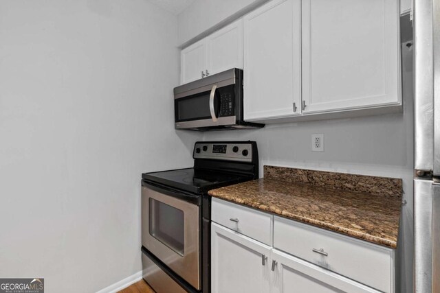1150 Collier Rd NW Unit 6H, Atlanta, GA 30318 - unfurnished room featuring wood finished floors, ornamental molding, baseboards, and recessed lighting