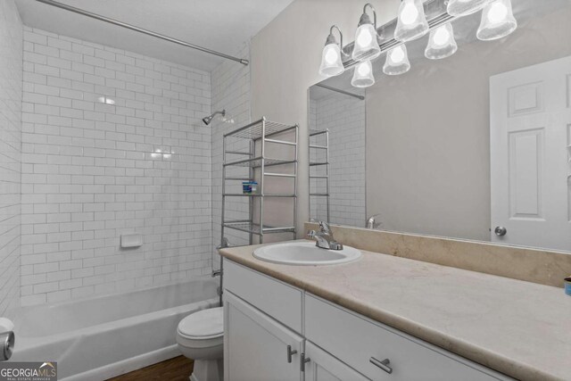1150 Collier Rd NW Unit 6H, Atlanta, GA 30318 - kitchen featuring appliances with stainless steel finishes, light wood-style flooring, white cabinetry, baseboards, and ornamental molding