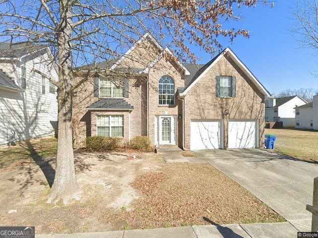 4466 Estate St, South Fulton, GA 30349 - traditional-style home with an attached garage, concrete driveway, and brick siding