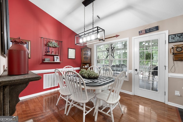 341 Jodeco Station Cir E, Stockbridge, GA 30281 - dining area featuring baseboards, wood finished floors, and vaulted ceiling