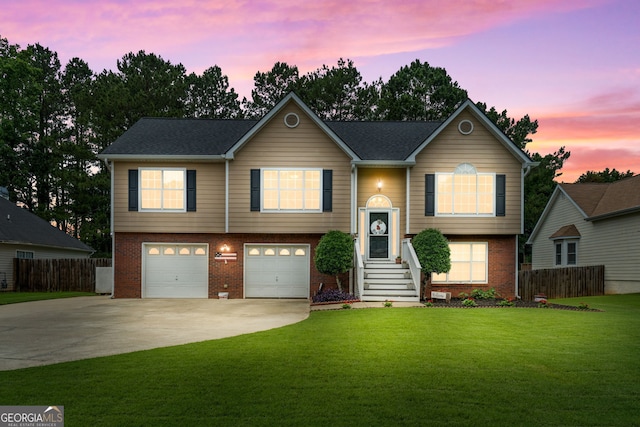 341 Jodeco Station Cir E, Stockbridge, GA 30281 - bi-level home featuring brick siding, concrete driveway, and an attached garage