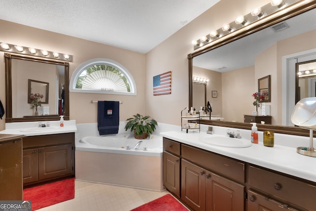 341 Jodeco Station Cir E, Stockbridge, GA 30281 - bathroom featuring two vanities, a bath, and tile patterned floors
