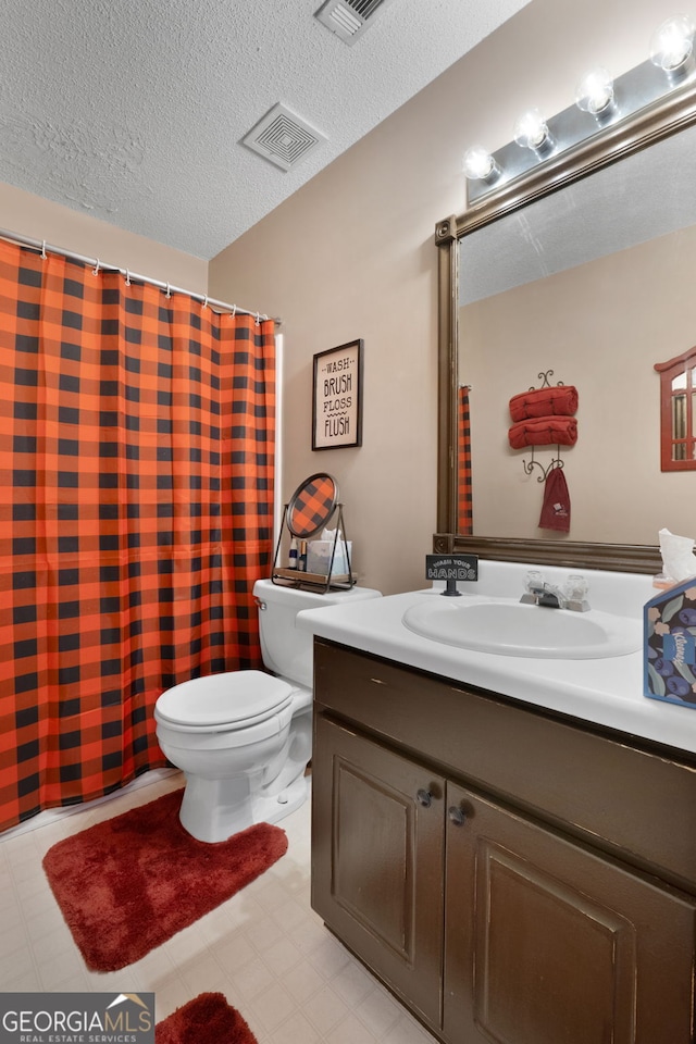 341 Jodeco Station Cir E, Stockbridge, GA 30281 - bathroom with toilet, vanity, a textured ceiling, and a shower with shower curtain