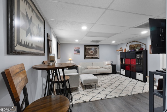 341 Jodeco Station Cir E, Stockbridge, GA 30281 - living room featuring wood finished floors, a drop ceiling, and recessed lighting