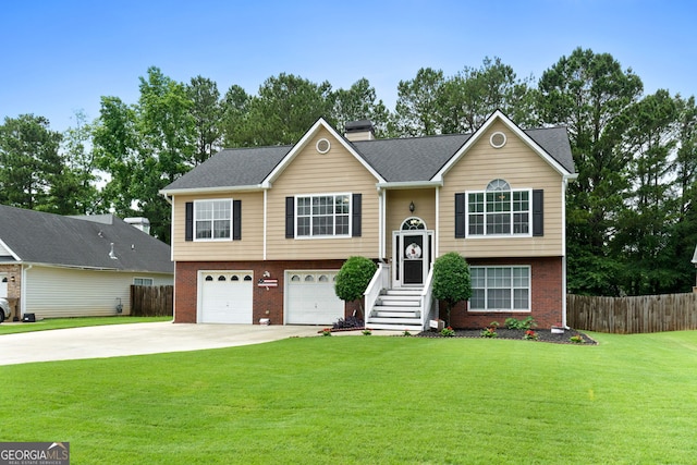 341 Jodeco Station Cir E, Stockbridge, GA 30281 - bi-level home with brick siding, concrete driveway, a chimney, and an attached garage