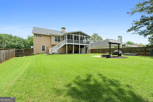 341 Jodeco Station Cir E, Stockbridge, GA 30281 - back of property with a sunroom, stairs, a chimney, and a fire pit