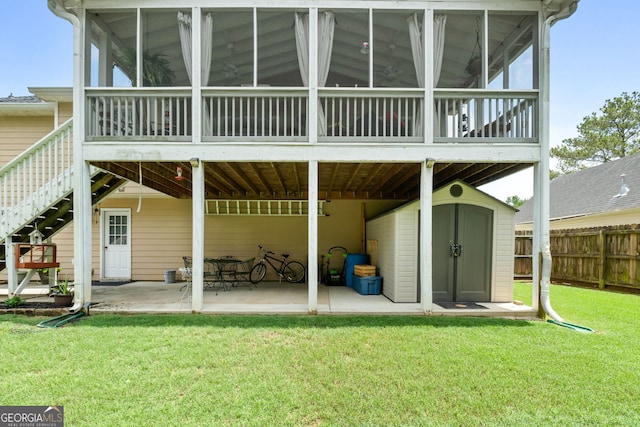 341 Jodeco Station Cir E, Stockbridge, GA 30281 - rear view of house with a sunroom, a patio, and stairs