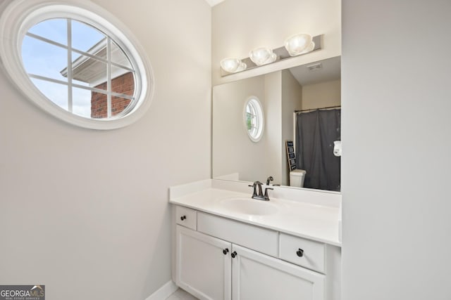 75 Vinings Lake Dr SW, Mableton, GA 30126 - full bath featuring vanity, healthy amount of natural light, baseboards, and a shower with curtain