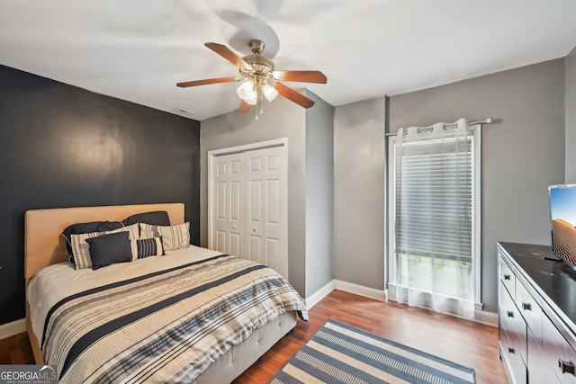 75 Vinings Lake Dr SW, Mableton, GA 30126 - bedroom with baseboards, a closet, wood finished floors, and ceiling fan