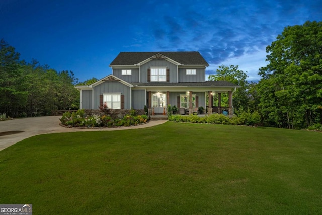 175 Stoneledge Trce N, Jasper, GA 30143 - craftsman-style home with board and batten siding, covered porch, a front lawn, and concrete driveway
