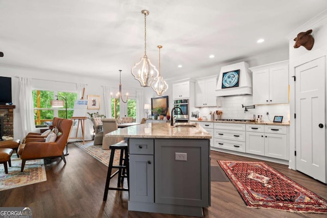 175 Stoneledge Trce N, Jasper, GA 30143 - kitchen featuring a sink, a chandelier, stainless steel oven, gas cooktop, and white cabinets