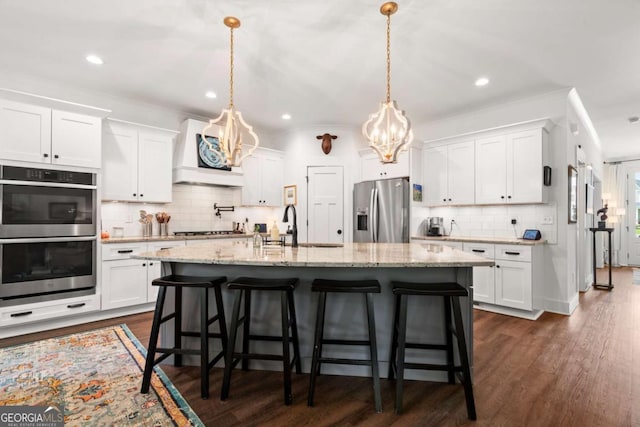 175 Stoneledge Trce N, Jasper, GA 30143 - kitchen featuring appliances with stainless steel finishes, a chandelier, premium range hood, tasteful backsplash, and a sink
