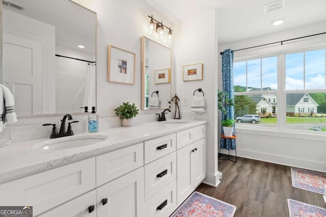 175 Stoneledge Trce N, Jasper, GA 30143 - full bath with double vanity, wood finished floors, recessed lighting, and a shower with shower curtain