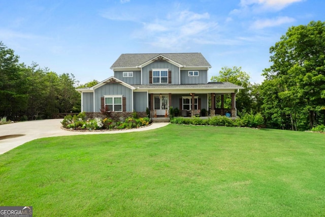 175 Stoneledge Trce N, Jasper, GA 30143 - craftsman-style home with board and batten siding, a front yard, covered porch, driveway, and a ceiling fan