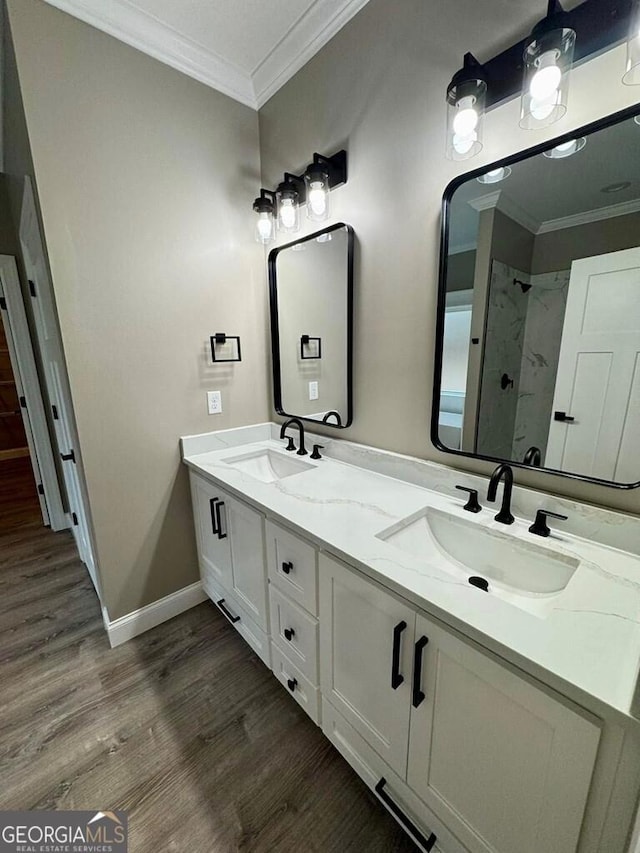 1231 Whipples Crossing Rd, Dudley, GA 31022 - full bath with double vanity, crown molding, wood finished floors, and a shower